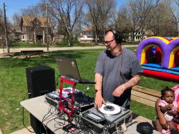 A DJ spins tunes in the park